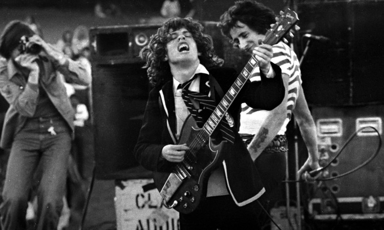 Mandatory Credit: Photo by Philip Morris / Rex Features ( 605955h ) AC/DC in concert, Angus Young and Bon Scott - 1975 Various - 1970s